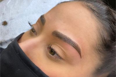a woman with a beautiful eyebrow